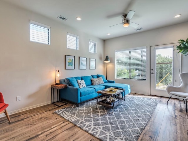 124 Cumberland Rd Unit 401, Austin, TX 78704 - living room with wood finished floors, plenty of natural light, a ceiling fan, and recessed lighting
