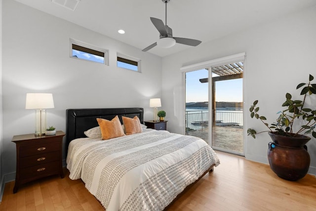 19000 Silver Maple Dr, Lago Vista, TX 78645 - bedroom featuring access to exterior, light wood-style floors, recessed lighting, a water view, and a ceiling fan