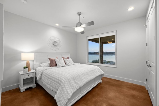 19000 Silver Maple Dr, Lago Vista, TX 78645 - bedroom featuring baseboards, dark carpet, recessed lighting, a ceiling fan, and a water view