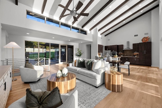 19000 Silver Maple Dr, Lago Vista, TX 78645 - living room featuring high vaulted ceiling, a ceiling fan, light wood-style floors, beam ceiling, and recessed lighting