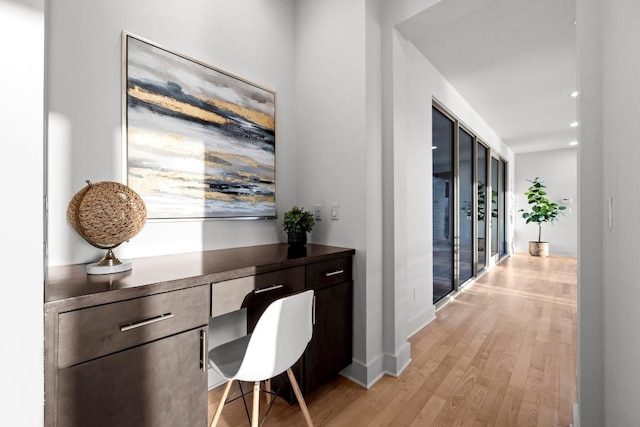 19000 Silver Maple Dr, Lago Vista, TX 78645 - office area featuring light wood-style flooring, built in study area, baseboards, and recessed lighting