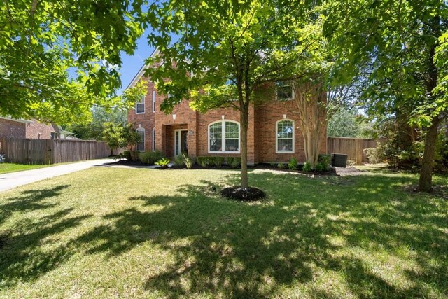13617 Sun Dapple Ct, Manor, TX 78653 - view of front facade with brick siding and central AC unit