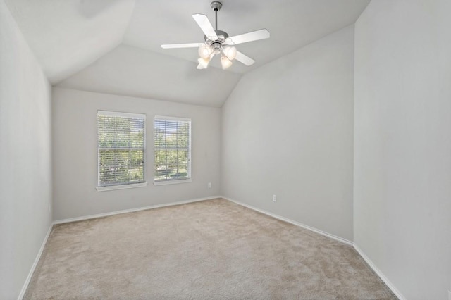 13617 Sun Dapple Ct, Manor, TX 78653 - carpeted spare room with vaulted ceiling, baseboards, and a ceiling fan