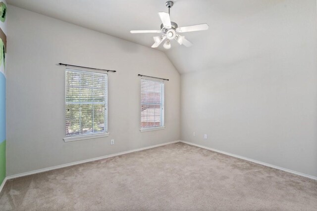 13617 Sun Dapple Ct, Manor, TX 78653 - unfurnished room with carpet flooring, ceiling fan, baseboards, and lofted ceiling
