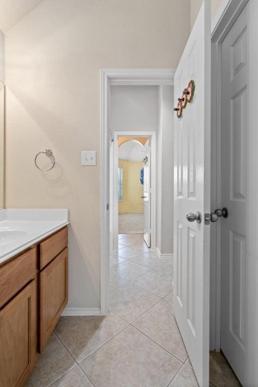 13617 Sun Dapple Ct, Manor, TX 78653 - bathroom featuring tile patterned floors, baseboards, and vanity
