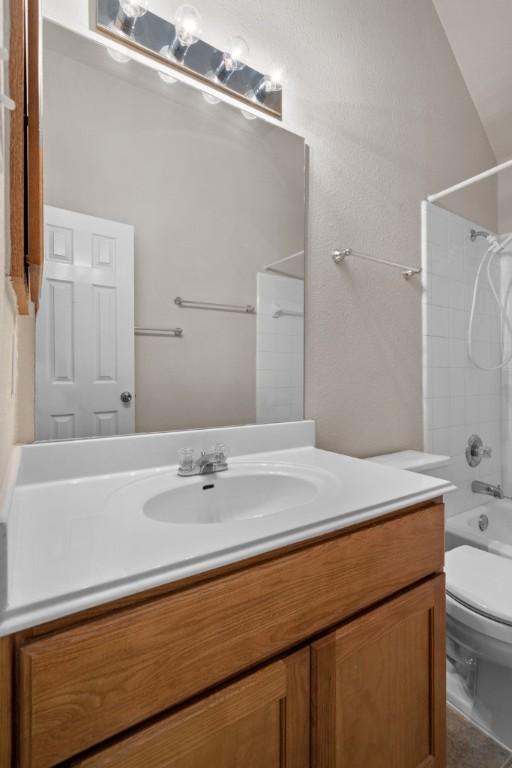 13617 Sun Dapple Ct, Manor, TX 78653 - full bathroom featuring vanity, toilet, and tub / shower combination