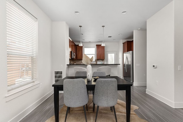 1601 Miriam Ave Unit 210, Austin, TX 78702 - dining space with dark wood-style flooring, baseboards, and recessed lighting
