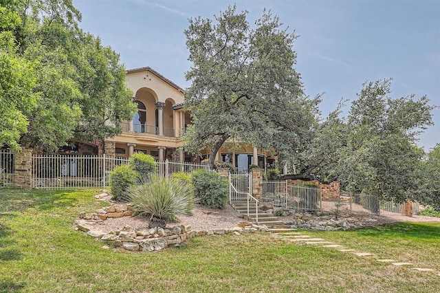 312 Camino Arbolago, Lakeway, TX 78734 - rear view of property featuring a balcony and stucco siding