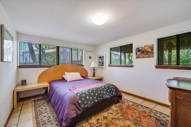 3403 Spanish Oak Dr, Austin, TX 78731 - tiled bedroom featuring baseboards