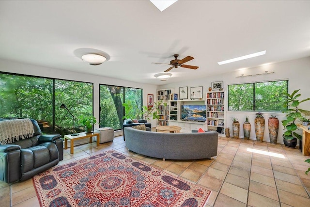 3403 Spanish Oak Dr, Austin, TX 78731 - tiled living room with a skylight and a ceiling fan