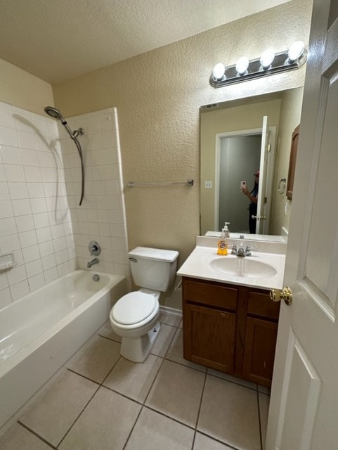 221 Roadrunner Ave, New Braunfels, TX 78130 - full bath with tile patterned flooring, vanity, shower / bath combination, toilet, and a textured wall