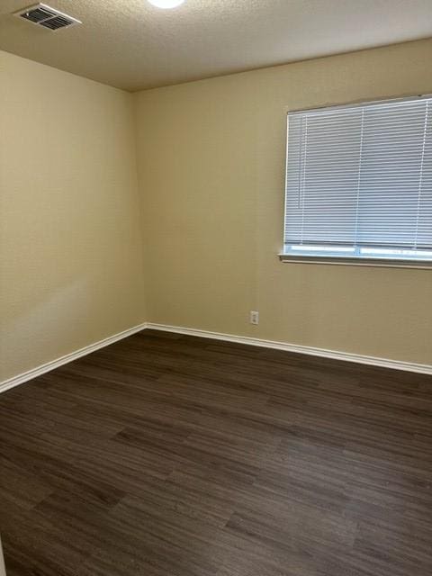 221 Roadrunner Ave, New Braunfels, TX 78130 - spare room featuring dark wood-style floors and baseboards