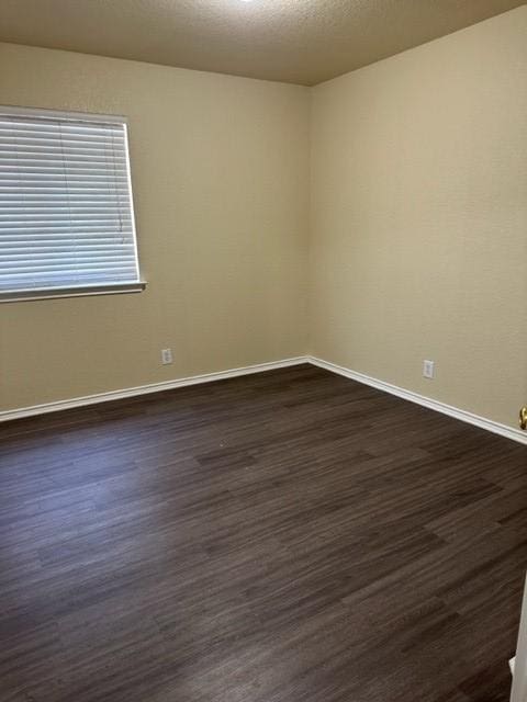 221 Roadrunner Ave, New Braunfels, TX 78130 - unfurnished room featuring dark wood-style floors and baseboards
