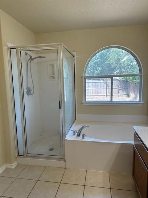 221 Roadrunner Ave, New Braunfels, TX 78130 - full bathroom with vanity, tile patterned floors, a stall shower, and a bath