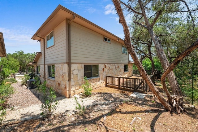 14101 Washoe Cir, Austin, TX 78734 - view of side of property featuring stone siding