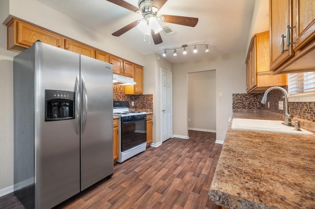 14101 Washoe Cir, Austin, TX 78734 - kitchen with stainless steel refrigerator with ice dispenser, white range with gas stovetop, a sink, under cabinet range hood, and backsplash
