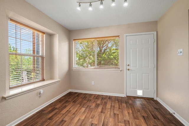 14101 Washoe Cir, Austin, TX 78734 - foyer entrance with dark wood-type flooring and baseboards