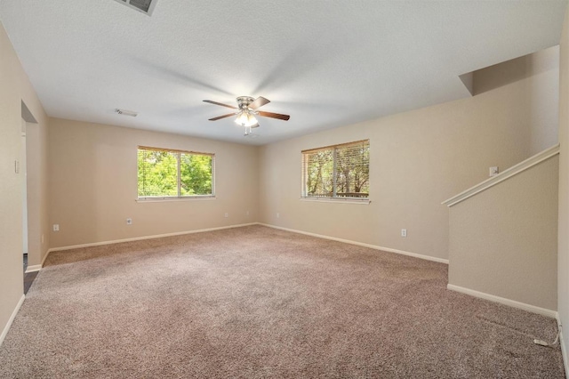 14101 Washoe Cir, Austin, TX 78734 - empty room with a ceiling fan, carpet, and baseboards