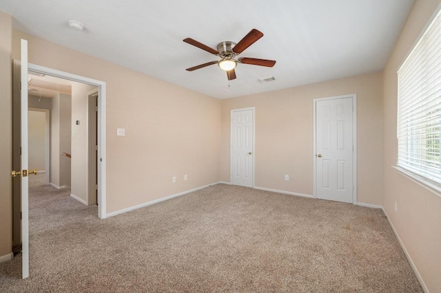 14101 Washoe Cir, Austin, TX 78734 - unfurnished bedroom with carpet, baseboards, and a ceiling fan