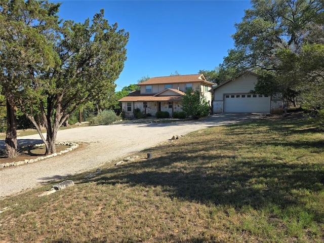 14101 Washoe Cir, Austin, TX 78734 - view of front of home with driveway, a garage, and a front yard