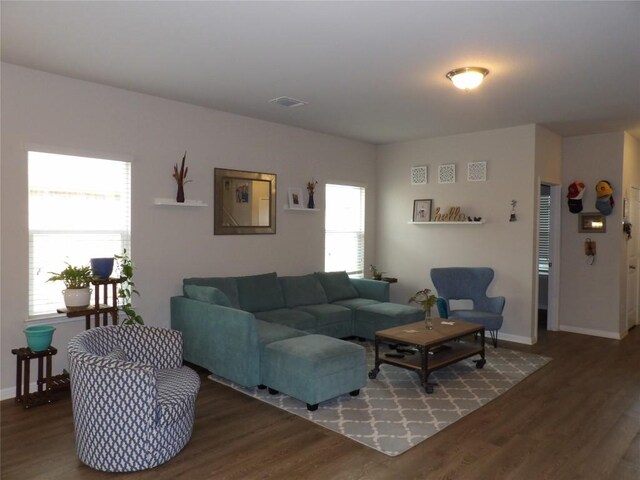 3097 Blantyre Bnd, Round Rock, TX 78664 - living room featuring healthy amount of natural light, wood finished floors, and baseboards