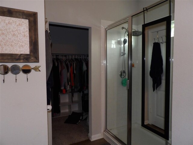 3097 Blantyre Bnd, Round Rock, TX 78664 - bathroom featuring a stall shower and a walk in closet