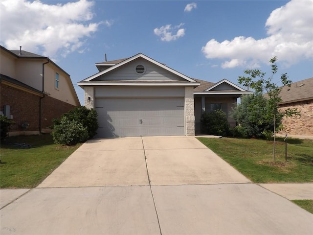 3097 Blantyre Bnd, Round Rock, TX 78664 - view of front of home featuring concrete driveway, a front yard, and an attached garage