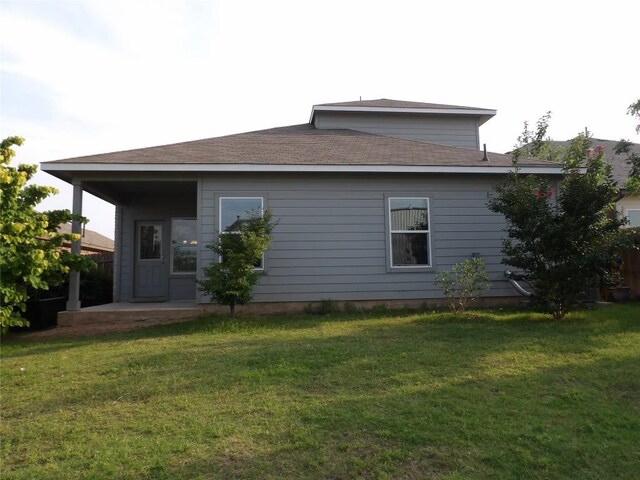3097 Blantyre Bnd, Round Rock, TX 78664 - rear view of property featuring a lawn