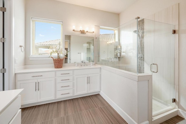 2613 Ibaza Bnd Unit 58, Leander, TX 78641 - bathroom with vanity and a shower stall
