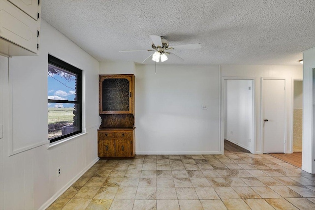 14615 Armstrong Rd, Salado, TX 76571 - unfurnished room featuring a ceiling fan, a textured ceiling, and baseboards