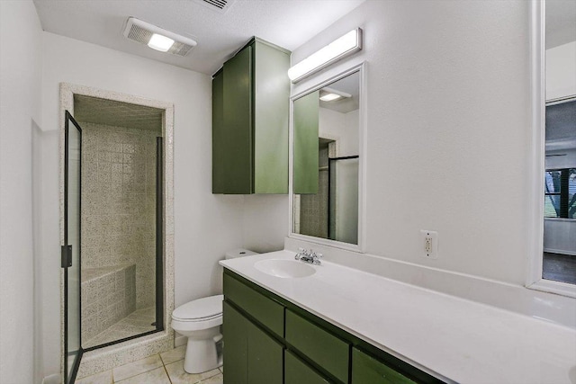 14615 Armstrong Rd, Salado, TX 76571 - full bathroom with toilet, a stall shower, vanity, and tile patterned flooring