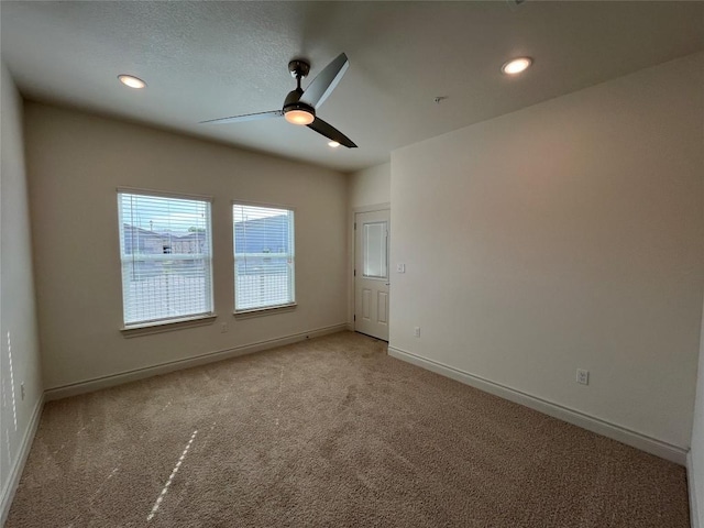 2105 Tiger Trl Unit 503, Round Rock, TX 78665 - empty room featuring light colored carpet, a ceiling fan, baseboards, and recessed lighting