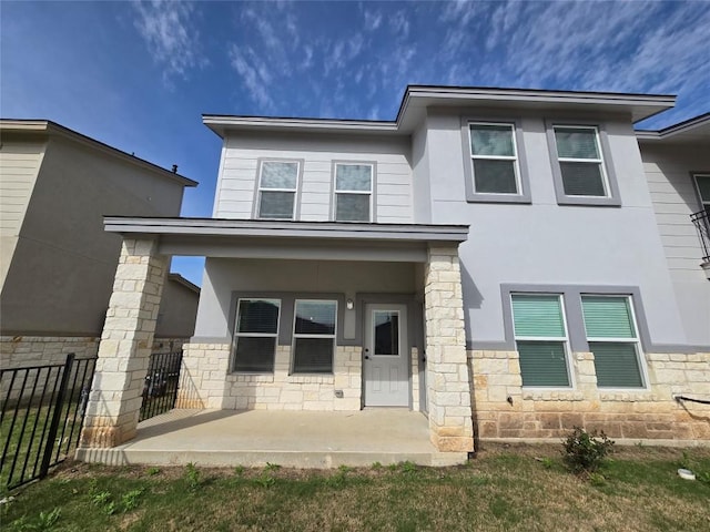 2105 Tiger Trl Unit 503, Round Rock, TX 78665 - rear view of house with stone siding and stucco siding