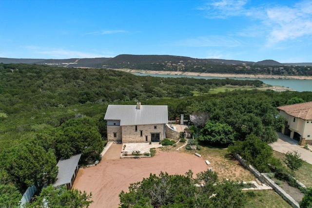 8207 Moon Rise Trl, Jonestown, TX 78645 - view from above of property featuring a heavily wooded area and a water and mountain view