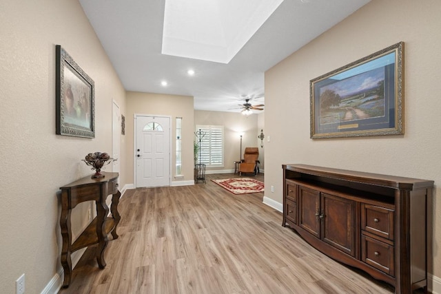 606 Explorer, Lakeway, TX 78734 - foyer entrance featuring light wood-style floors, a skylight, recessed lighting, and ceiling fan