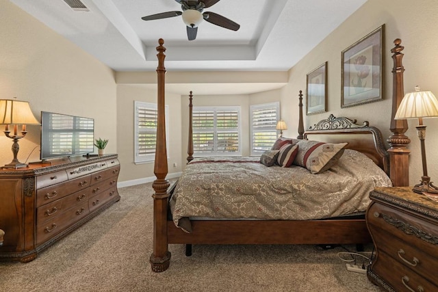 606 Explorer, Lakeway, TX 78734 - bedroom with carpet floors, a tray ceiling, and ceiling fan