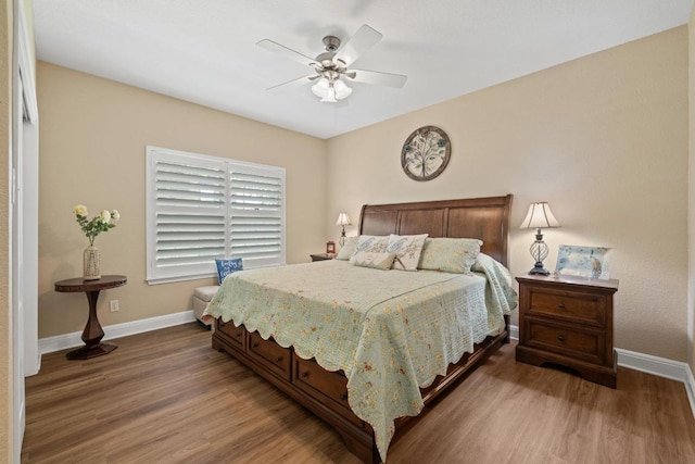 606 Explorer, Lakeway, TX 78734 - bedroom with baseboards, wood finished floors, and a ceiling fan
