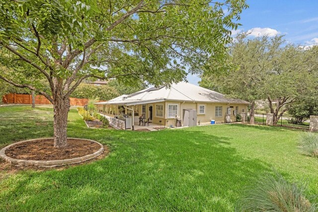606 Explorer, Lakeway, TX 78734 - rear view of property with a fenced backyard and a patio area