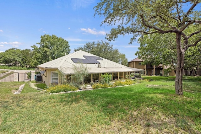 606 Explorer, Lakeway, TX 78734 - rear view of property featuring solar panels and a gate