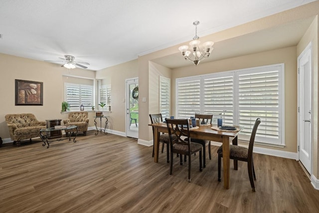 606 Explorer, Lakeway, TX 78734 - dining space featuring wood finished floors, a chandelier, baseboards, and a ceiling fan