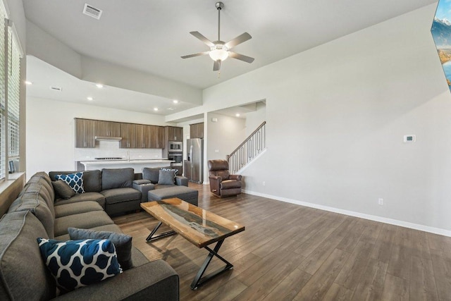 357 Cathedral Mountain Dr, Dripping Springs, TX 78620 - living area featuring dark wood-style flooring, ceiling fan, baseboards, recessed lighting, and stairway