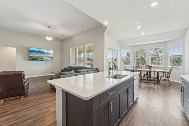 357 Cathedral Mountain Dr, Dripping Springs, TX 78620 - kitchen featuring dark wood finished floors, light countertops, recessed lighting, open floor plan, and an island with sink