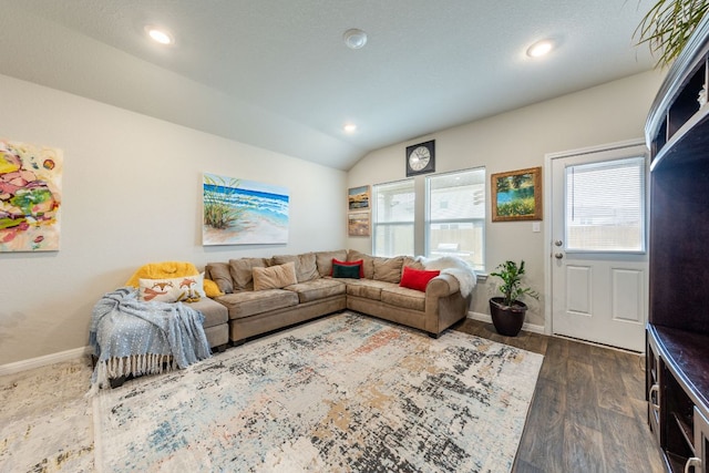 221 Tributary Way, Bastrop, TX 78602 - living area with healthy amount of natural light, lofted ceiling, dark wood-type flooring, and recessed lighting