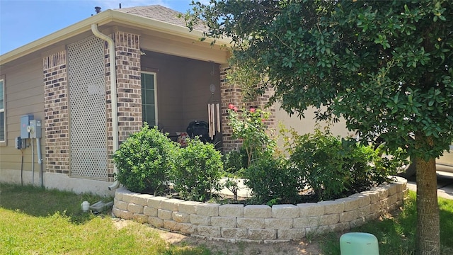 221 Tributary Way, Bastrop, TX 78602 - view of side of home featuring brick siding