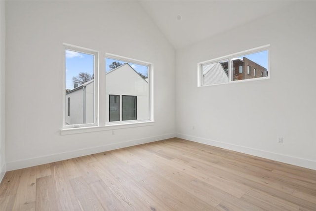 900 S 2nd St Unit 21, Austin, TX 78704 - additional living space with plenty of natural light, light wood-style floors, baseboards, and high vaulted ceiling