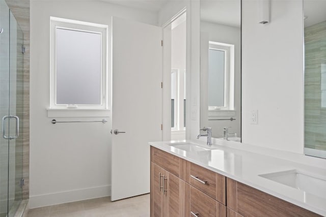 900 S 2nd St Unit 21, Austin, TX 78704 - bathroom with double vanity, a stall shower, and baseboards