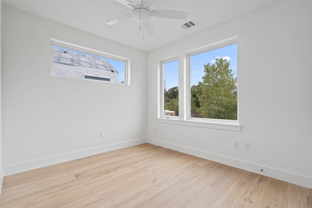 900 S 2nd St Unit 21, Austin, TX 78704 - spare room featuring baseboards, light wood-style floors, and ceiling fan