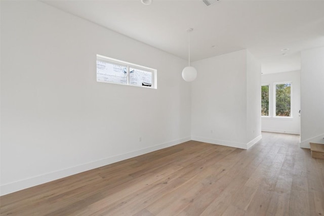 900 S 2nd St Unit 21, Austin, TX 78704 - empty room featuring light wood-type flooring and baseboards