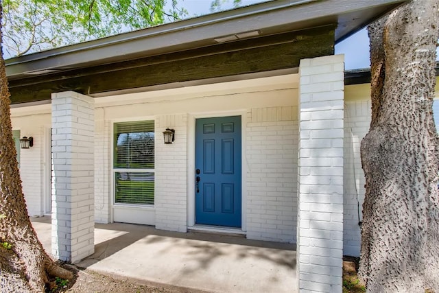 312 W William Cannon Dr, Austin, TX 78745 - entrance to property featuring brick siding and a porch