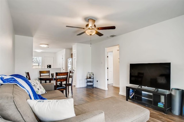 312 W William Cannon Dr, Austin, TX 78745 - living room featuring wood finished floors, a ceiling fan, and baseboards